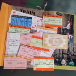 Storing old train tickets in an envelope notebook
